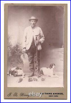 CIRCA 1870s CABINET CARD OLD RABBIT HUNTER HOLDING SHOTGUN WITH DOGS NEW YORK