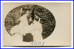 Unusual antique rppc photo, group of women with their backs to the camera